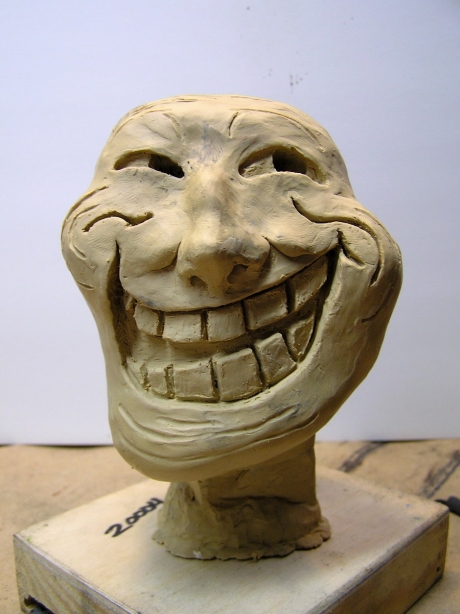 Trollface clay sculpture